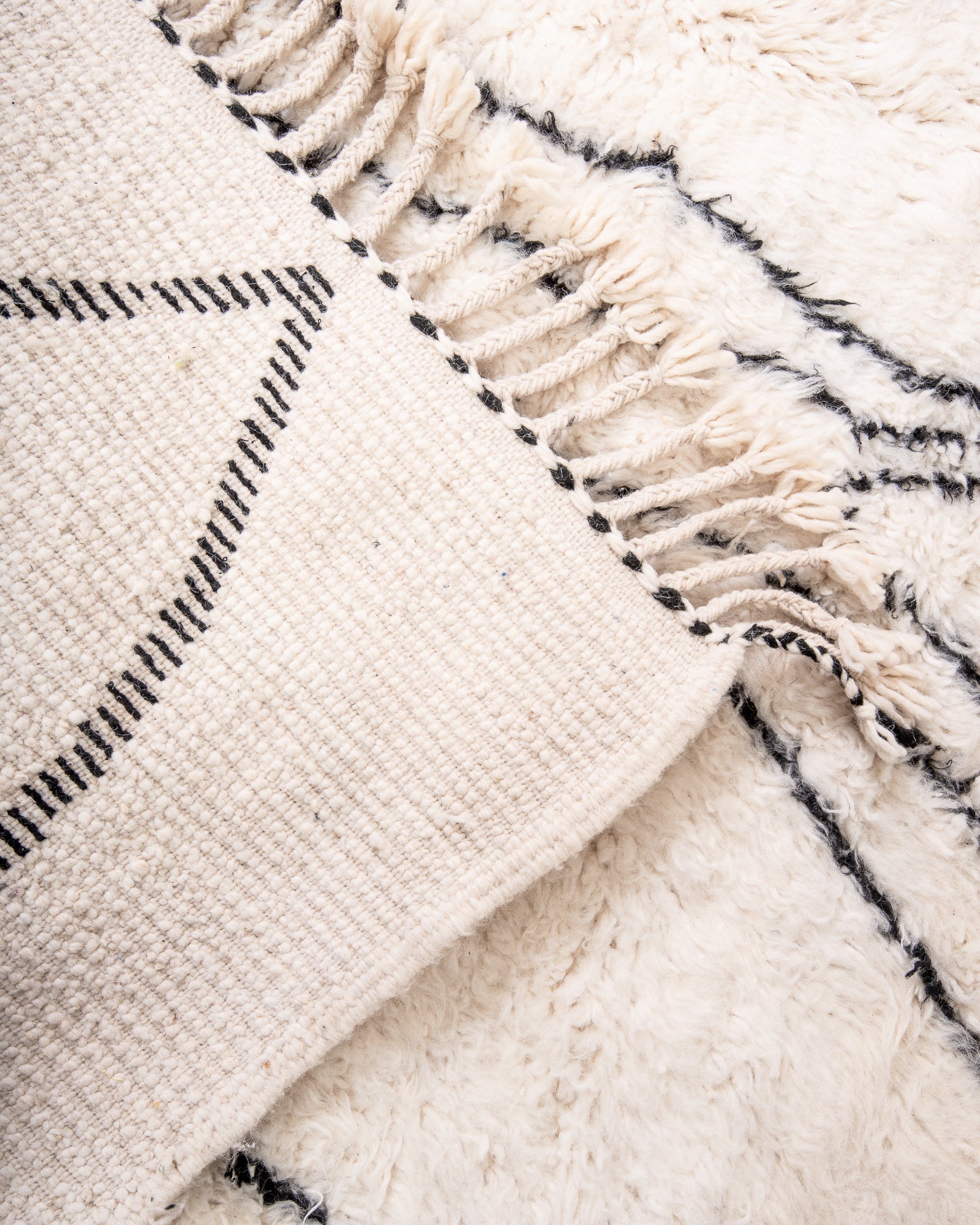 Modern, designer, handcrafted Berber rug from Morocco. Beniourain carpet with beautiful colours and patterns and fluffy wool texture.